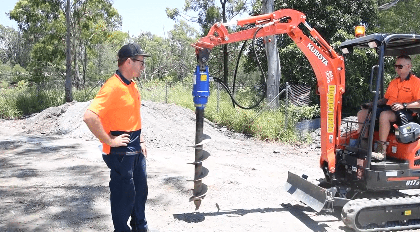 Test the mini excavator with auger attachment by doing clockwise and counterclockwise motion